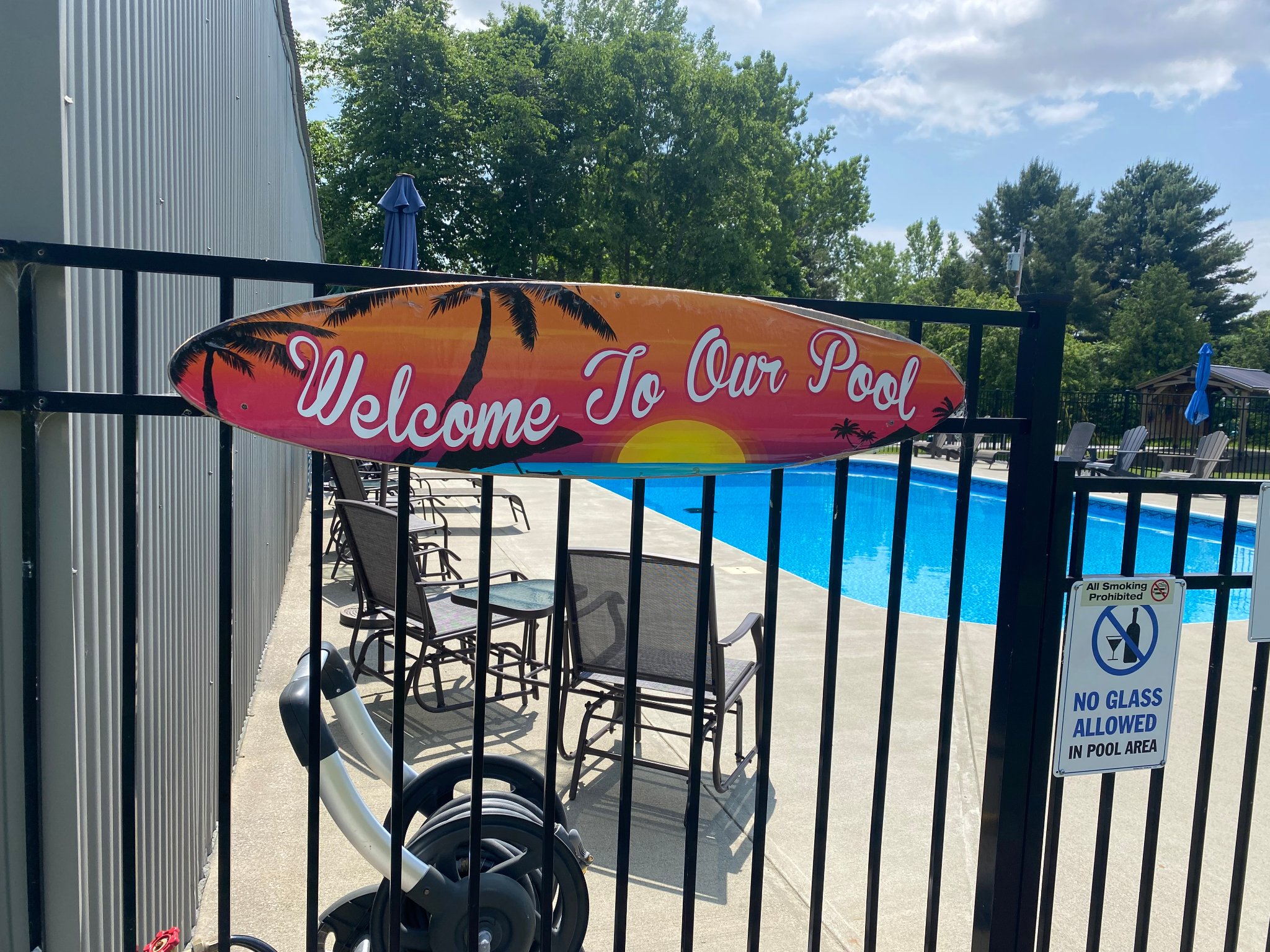 Welcome to Our Pool sign at the pool entrance